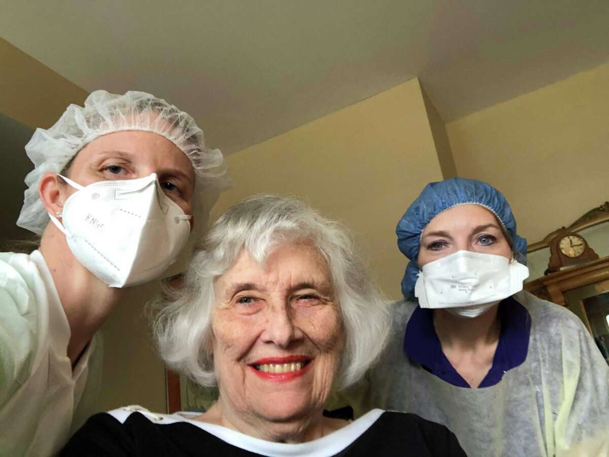 Pat Larson had a broad smile after being declared free of COVID-19. With her are RVNAhealth ComfortWELL nurses Anne Felizardo, LPN, and Christine Palmer, RN, BSN.