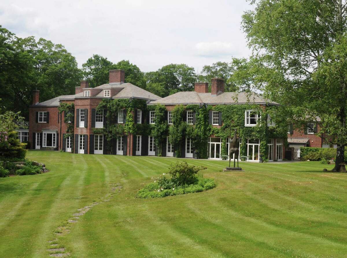 The brick mansion at 183 Great Hill Road in Ridgefield was designed by Noël and Miller, the architecture firm that did the Whitney Museum.