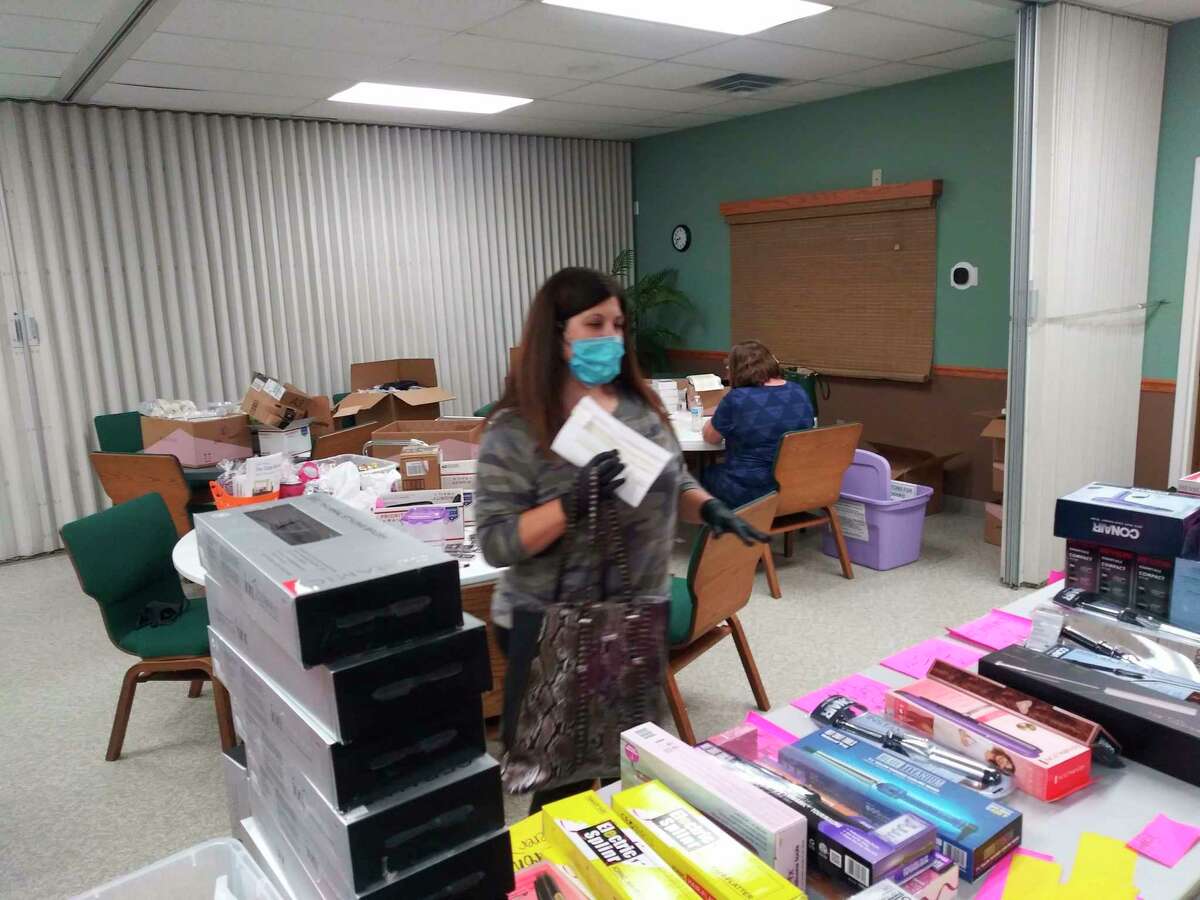 Volunteer Kim Binkley packs up materials. (Photo provided)