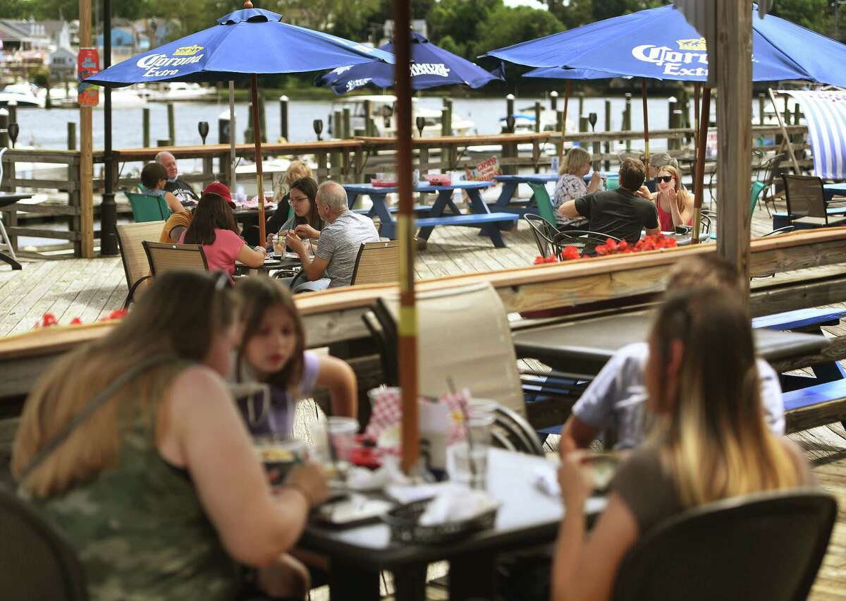 Customers dine outdoors on the first day of Phase II reopening at Joey C's Boathouse in Stratford, Conn. on Wednesday, June 17, 2020. That being said, it was shown to be safer to go to church, go shopping or head to the salon than eating or drinking at a bar or restaurant, probably (the CDC concludes) because you … can’t wear a mask and probably don’t keep as much distance from patrons and employees while you’re throwing back a few with nachos on the side. “Exposures and activities where mask use and social distancing are difficult to maintain, including going to places that offer on-site eating or drinking, might be important risk factors for acquiring COVID-19,” the CDC wrote. So, why are states allowing indoor dining? “In meetings with hundreds of owners of bars and breweries across the state, I’ve heard their stories of struggle,” Florida’s Department of Business and Professional Regulation Secretary Halsey Beshears said in a statement.