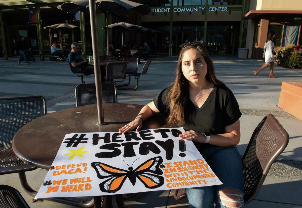 DACA program participant Valeria Blanco, a UC Davis honor student, holds a sign she made to take to a Sacramento Dreamers rally in November 2019. Blanco and hundreds of thousands of other Dreamers were facing their biggest battle yet as the Supreme Court was preparing to hear oral arguments in a case that examines the legality of the Deferred Action for Childhood Arrivals program.