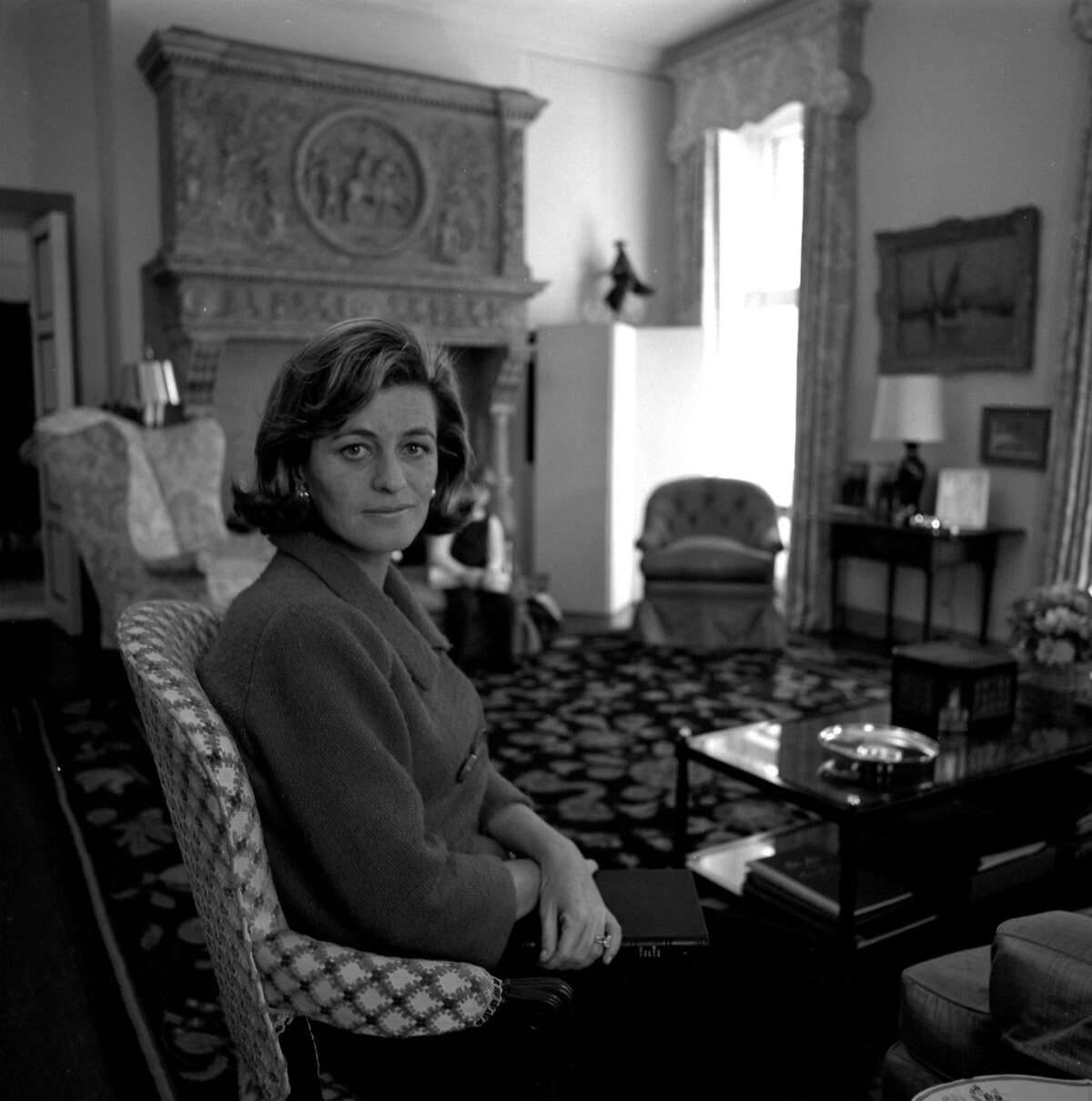 This handout picture provided by the John F. Kennedy Library Foundation shows a portrait of Jean Kennedy Smith seated in a chair with a book resting in her lap on February 16, 1965. - US President John F. Kennedy's last surviving sibling, Jean Kennedy Smith -- who was instrumental in bringing peace to Northern Ireland -- has died aged 92. Smith, who served as US ambassador to Ireland in the 1990s, passed away on June 17, 2020, at her home in Manhattan, The New York Times said. (Photo by Arthur Stettner / John F. Kennedy Library Foundation / AFP) / RESTRICTED TO EDITORIAL USE - MANDATORY MENTION OF THE ARTIST UPON PUBLICATION - MANDATORY CREDIT "AFP PHOTO /John F. Kennedy Library Foundation" - TO ILLUSTRATE THE EVENT AS SPECIFIED IN THE CAPTION - NO MARKETING NO ADVERTISING CAMPAIGNS - DISTRIBUTED AS A SERVICE TO CLIENTS - NO ARCHIVE / (Photo by ARTHUR STETTNER/John F. Kennedy Library Foundati/AFP via Getty Images)