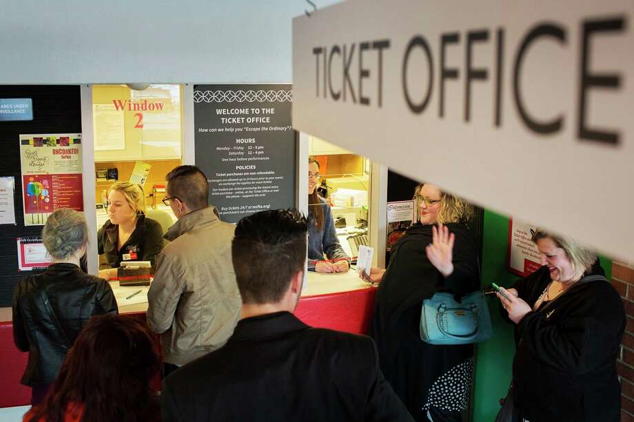 FILE — Midland Center for the Arts employees Sam Johnson, left, and Nicole Toth, right, manage the ticket office for customers waiting to see the production of The Mystery of Edwin Drood at the Center Stage Theatre and The Midland Symphony Orchestra in April of 2016. (Theophil Syslo/Daily News file)