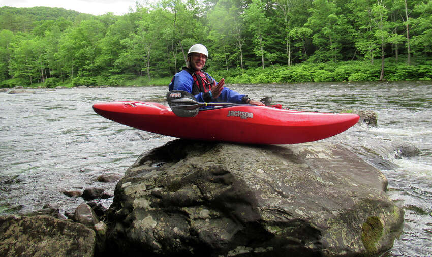 Outdoors columnist Herb Terns has a lot to learn about whitewater kayaking. He goofs around before performing a rock entry into the Deerfield River. (Courtesy of Herb Terns)