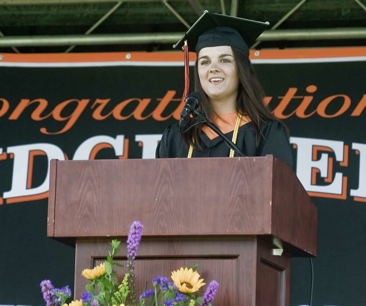Ridgefield High School Class Speaker, Kyra Linekin, addresses the students during the graduation ceremony held on the school grounds. Thursday, June 18, 2020. Class speaker Kyra Linekin noted 2020's strange turn, with coronavirus shutting down classes.