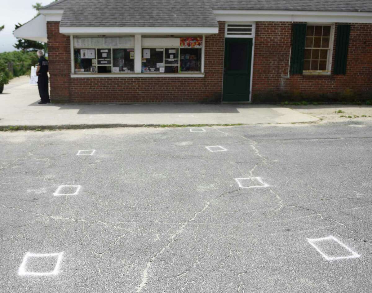 Squares are drawn outside the snack bar to promote social distancing at Greenwich Point Park in Old Greenwich, Conn. Thursday, June 18, 2020. The town’s beaches have been open to swimmers for a week now and steps are in place to maintain social distancing in the sand.