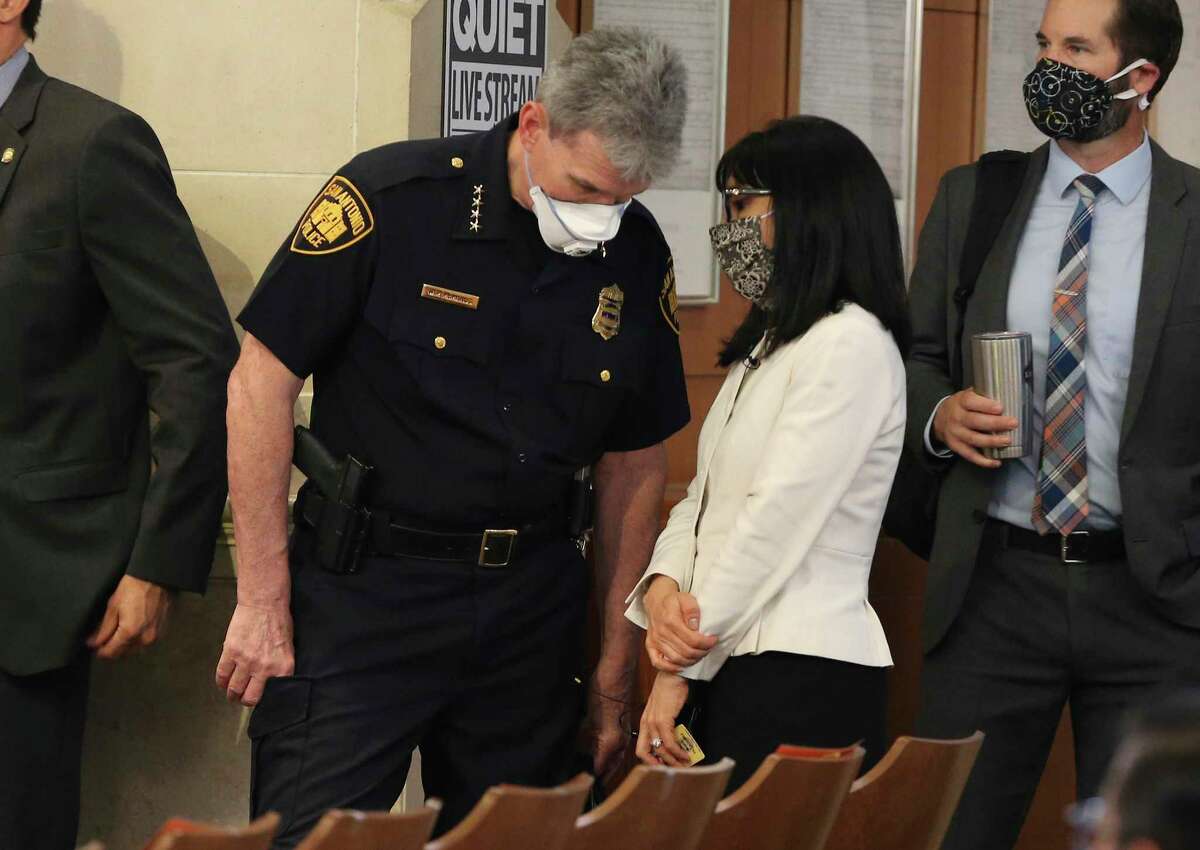 Police Chief William McManus (left) chats with Deputy City Manager Maria Villagomez (right) as San Antonio City Council gets its first look at next year's budget on Thursday. Budget officials are looking at cuts in next year's budget caused by economic fallout of the coronavirus pandemic.