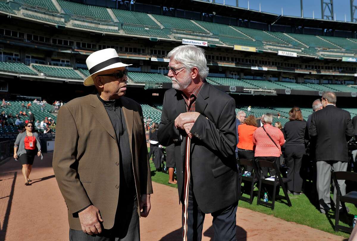 Giants announcer Mike Krukow chats with former teammate Orlando Cepeda during a public remembrance for Willie McCovey at AT&T Park in San Francisco, Calif., on Thursday, November 8, 2018.