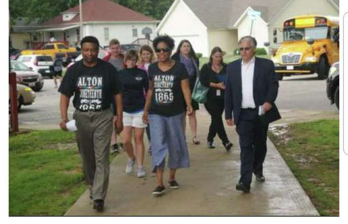 Guests at last year’s Alton Juneteenth Celebration, left to right, Ed Hightower, Illinois Lt. Gov. Juliana Stratton and Alton Mayor Brant Walker walk at James H. Killion Park at Salu, at Washington and Salu streets, in Alton, where Walker read a proclamation for Juneteenth.