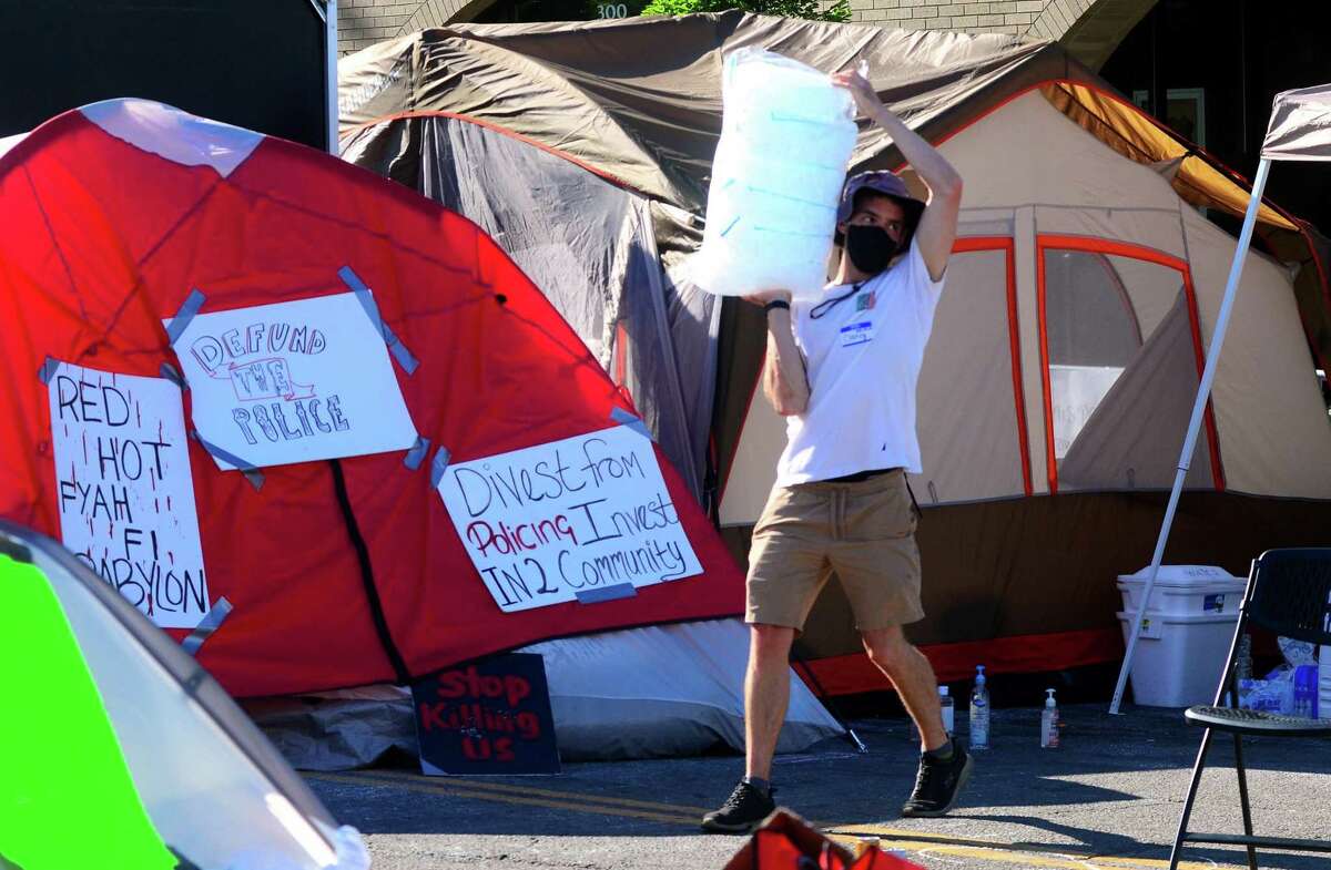 Dozens of protestors are living in a tent city in front of police headquarters on Congress Street in Bridgeport, Conn., on Wednesday June 17, 2020.