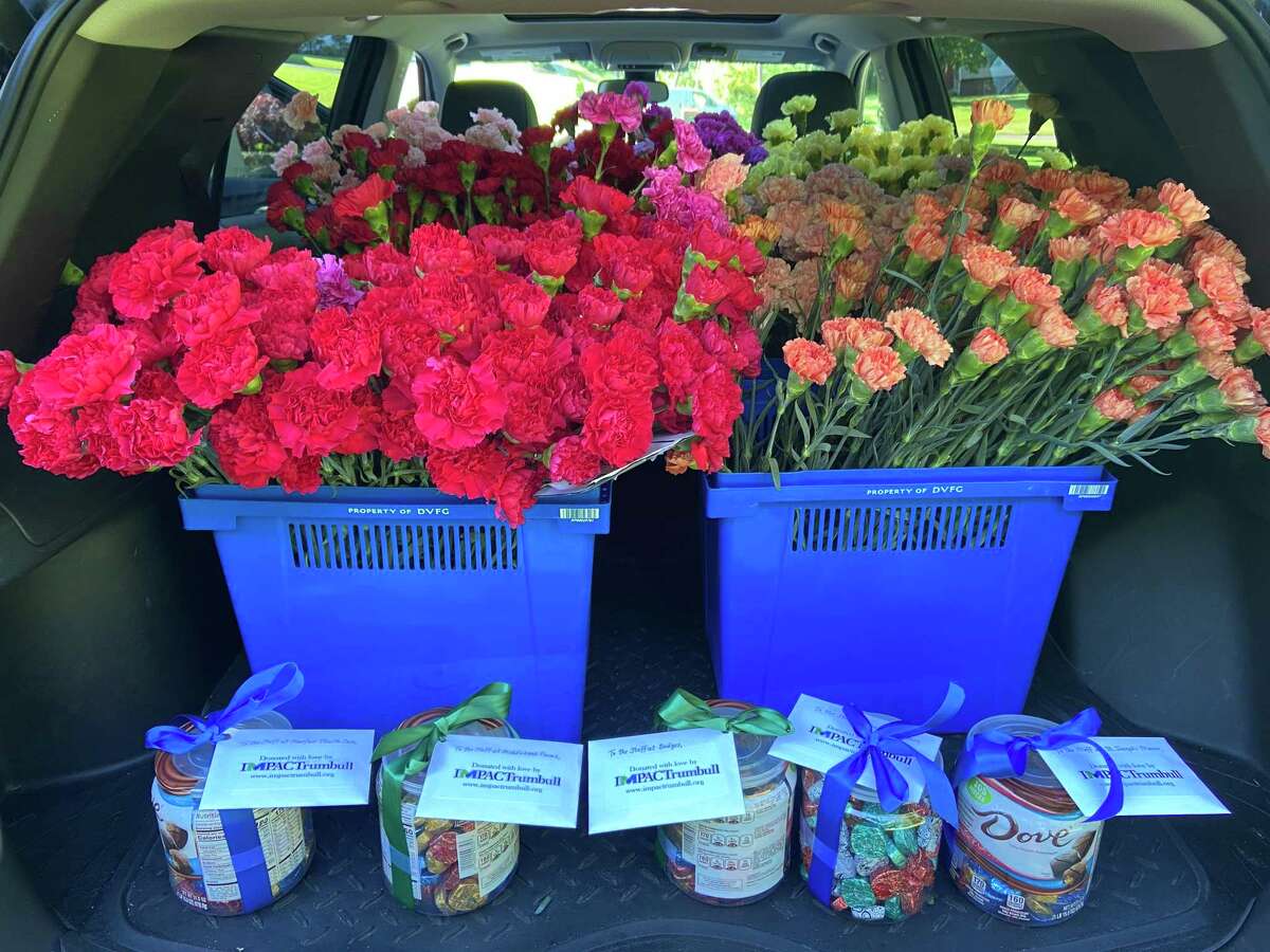 IMPACTrumbull, a local 501c3 in Trumbull that completes monthly community service projects, recently donated 1,200 carnations to the residents of all five nursing care facilities in Trumbull: Spring Meadows, Middlebrook Farms, Genesis St. Joseph's Manor, Maefair Healthcare, and EPOCH by Bridges, receiving a generous discount from City Line Florist and were able to donate a pair of carnations to all 600 residents. In addition, IMPACTrumbull sponsored a 5th round of collecting donations from the community, receiving more than $1,700 in donations from Trumbull residents and used that money to purchase gift cards to J Bagels, Old Towne Restaurant and Trumbull Pizza Company so that every shift at all five facilities would receive a meal. Gift cards were attached to canisters of chocolates for the staff lounges.