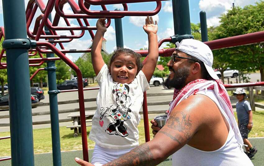 Ellie McKinnon, 4, of Schenectady has complete trust in her dad, Kealand McKinnon, who catches her as she lets go of the monkey bars while playing in the playground at The Crossings of Colonie on Friday, June 19, 2020 in Colonie, N.Y. (Lori Van Buren/Times Union)