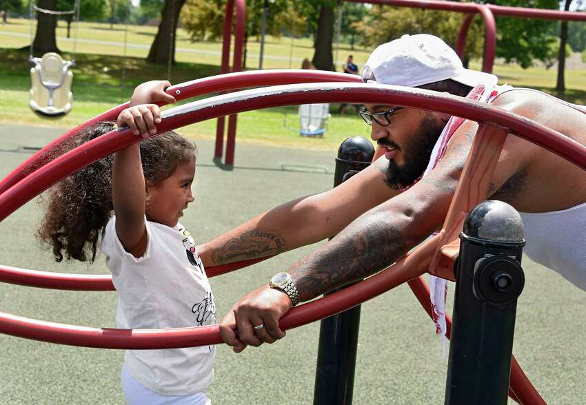 Ellie McKinnon, 4, of Schenectady plays with her dad, Kealand McKinnon, on the playground at The Crossings of Colonie on Friday, June 19, 2020 in Colonie, N.Y. (Lori Van Buren/Times Union)