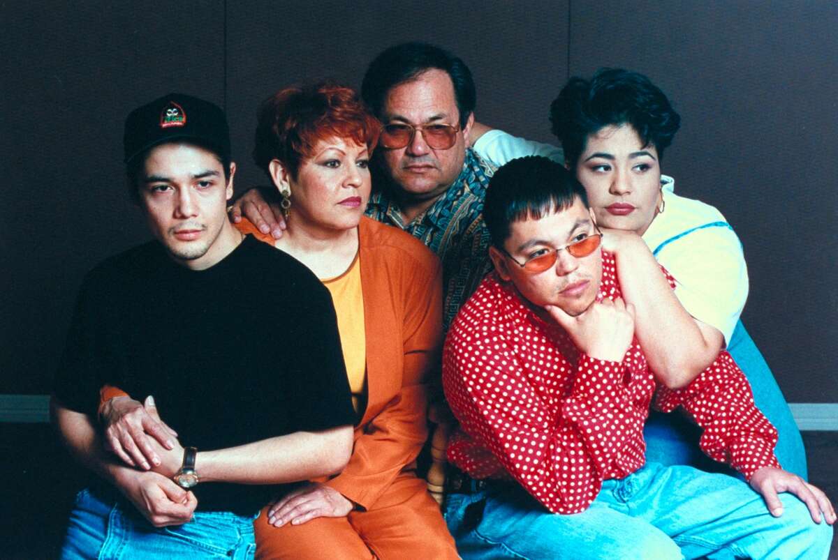Quintanilla is pictured with her with his other children, A.B. and Suzette, wife Marcela and Selena's then-husband Chris Perez.