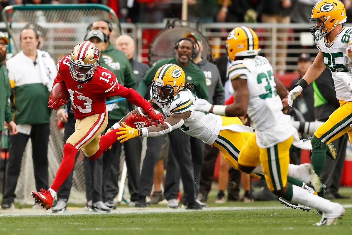 San Francisco 49ers’ Richie James gets past Green Bay Packers’ Jamaal Williams in the first quarter during the NFC Championship game between the San Francisco 49ers and the Green Bay Packers at Levi’s Stadium on Sunday, Jan. 19, 2020 in Santa Clara, Calif.