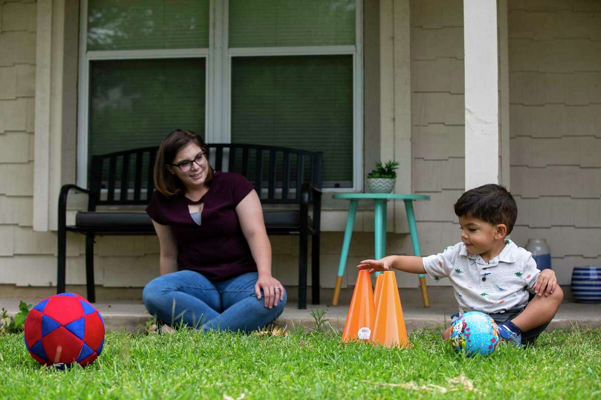 Nathan DeKing, 2, and his mother, Sarah Pollock, play on June 18, 2020.