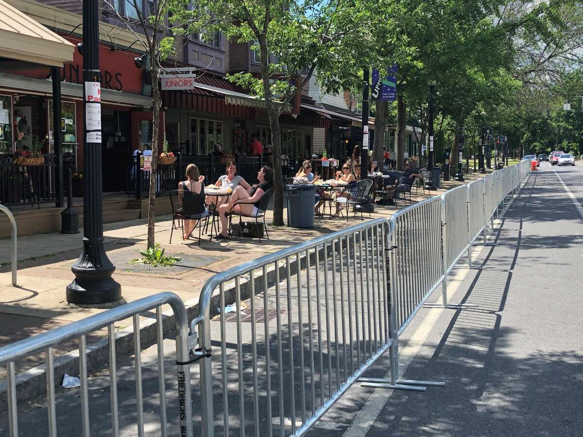 A pandemic-era necessity, expanded sidewalk dining proved popular with patrons and restaurants alike and has been continued on a permanent seasonal basis in cities including Saratoga Springs, Troy and Albany, as on this stretch of upper Madison Avenue.