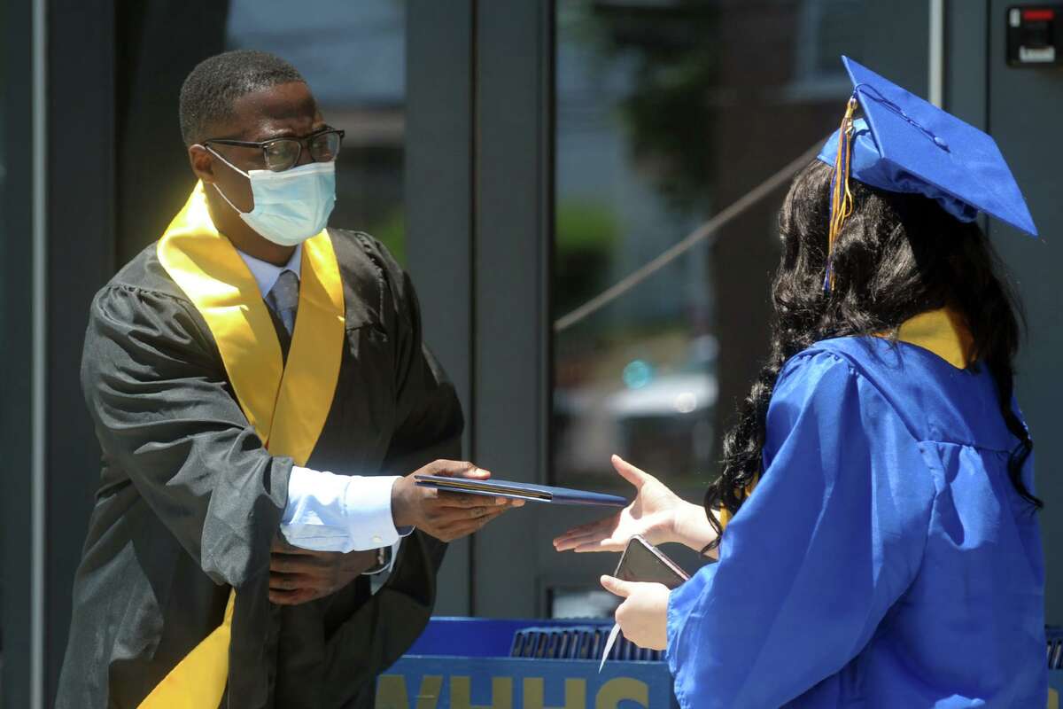 Photos In blue and yellow, Harding High graduates receive diplomas in