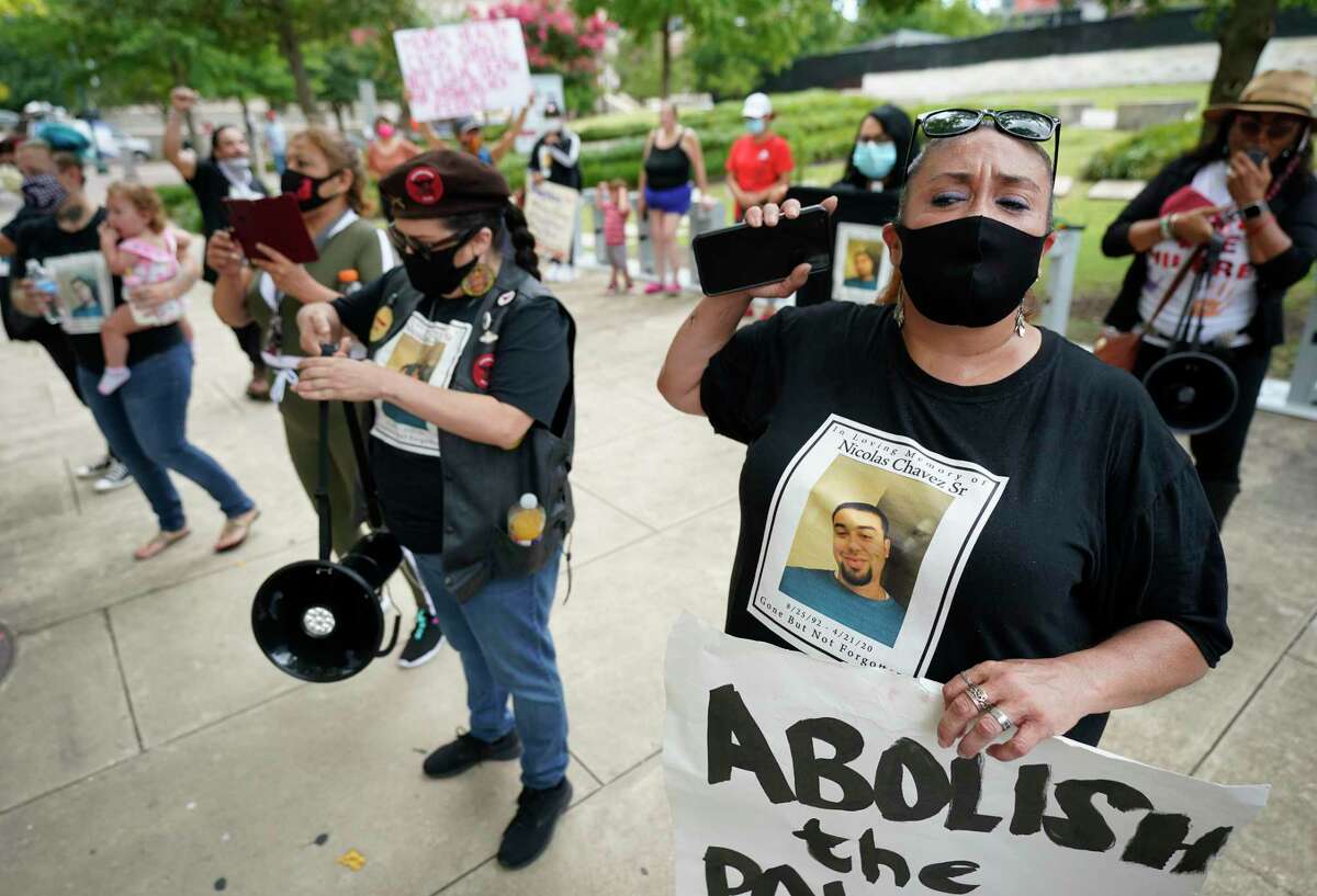 Leantha Chavez, right, who is the mother of Nicolas Chavez, protests with others the Harris County Criminal Courthouse Friday, June 19, 2020, in Houston. The protesters were denouncing the lack of action in the case of Nicolas Chavez, who was shot and killed by Houston police April 21, 2020.