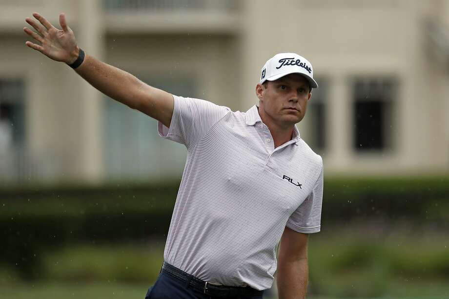 In this Thursday photo, Nick Watney signals after a tee shot during the first round of the RBC Heritage. Watney has tested positive for coronavirus and withdrew from the tournament on Friday. Photo: Gerry Broome / Associated Press