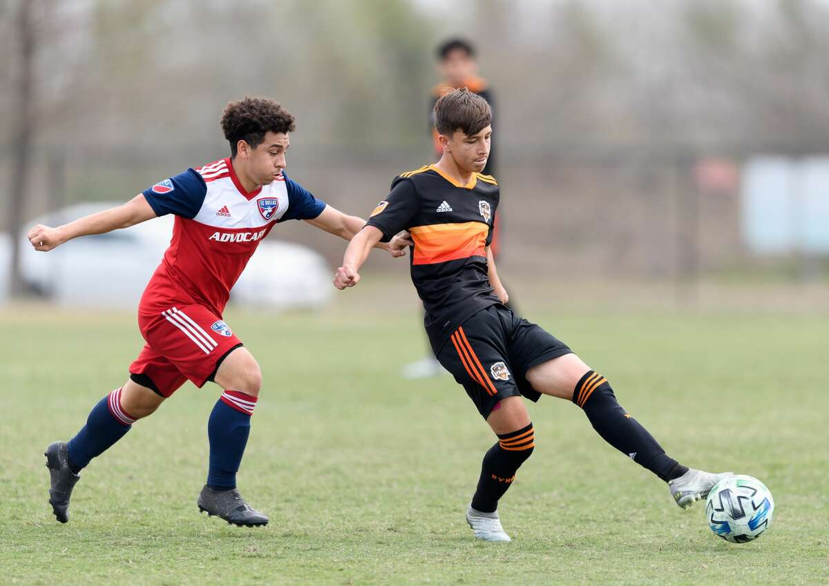 Juan Castilla, right, who turns 16 next month, is the youngest player to be signed to a homegrown contract with the Dynamo.