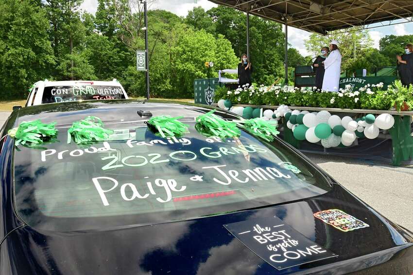 Graduate Jenna Meshon is seen receiving her diploma during a drive through graduation at Schalmont High School on Friday, June 19, 2020 in Rotterdam, N.Y. (Lori Van Buren/Times Union)