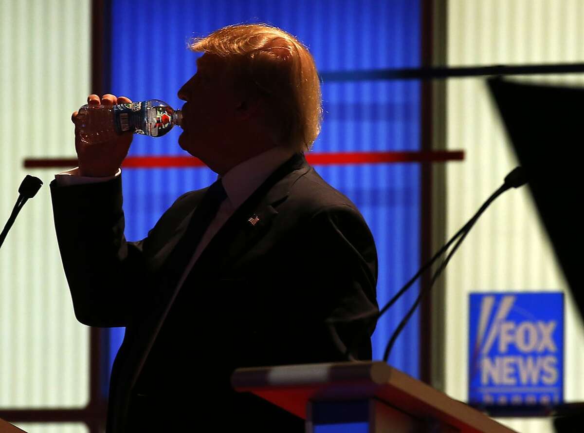 Republican presidential candidate, businessman Donald Trump takes a drink of water during a commercial break at a Republican presidential primary debate at Fox Theatre, Thursday, March 3, 2016, in Detroit. (AP Photo/Paul Sancya)