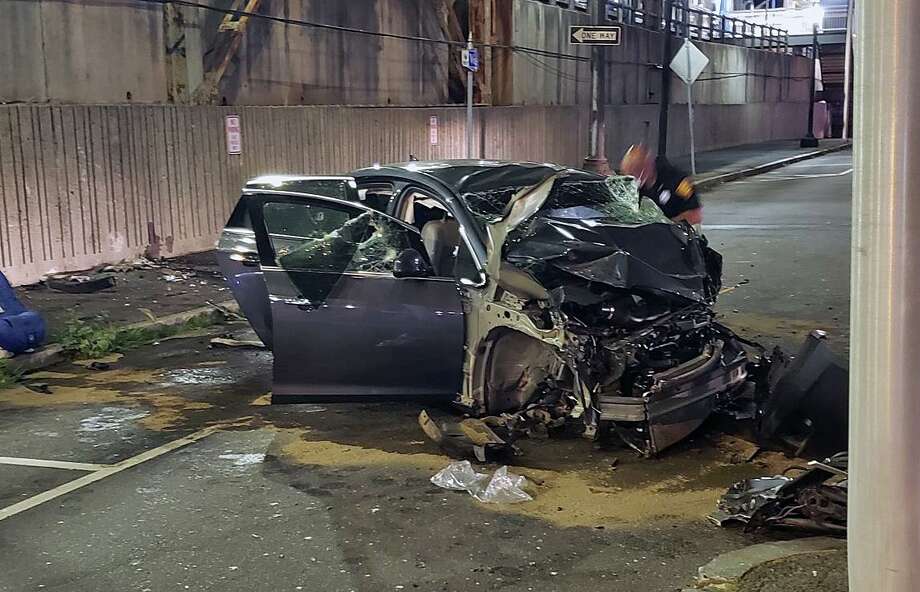 A vehicle crashed into the wall near the intersection of State and Water streets in Bridgeport, Conn., shortly before 10 p.m. Thursday, June 18, 2020. Photo: Contributed Photo / Bridgeport Police Department