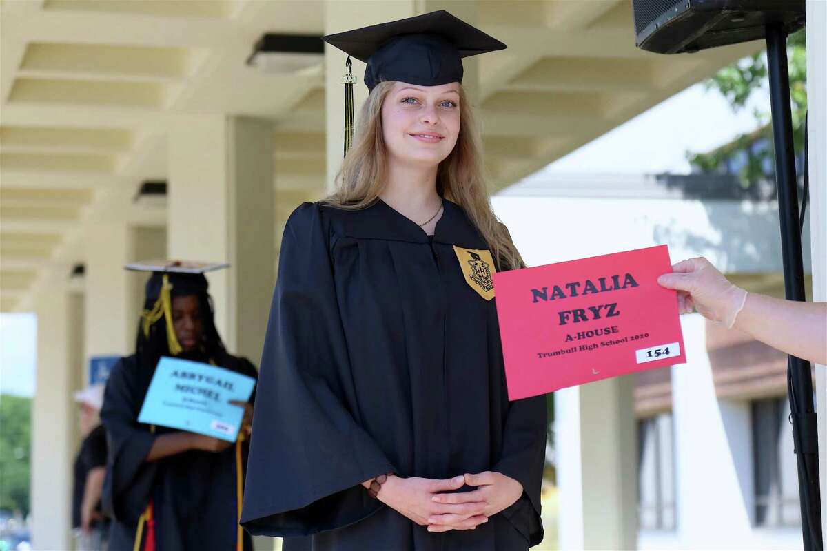 Natalia Fryz waits to receive her diploma cover.