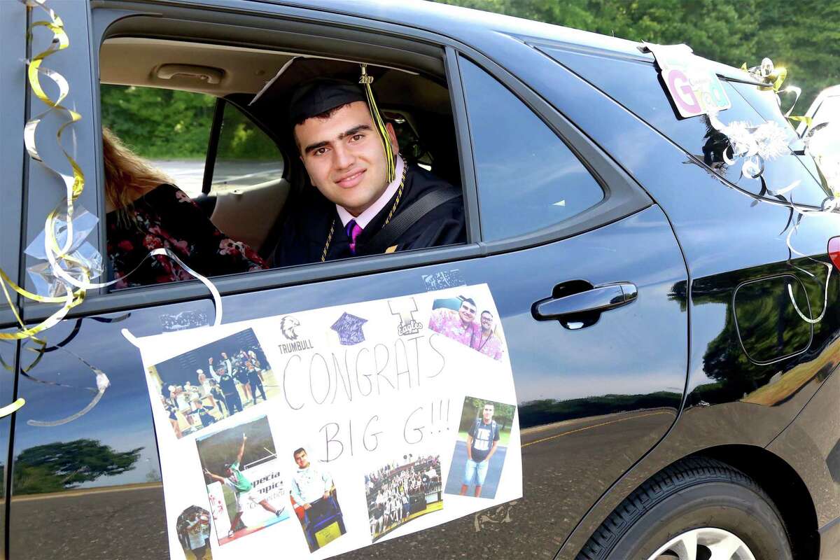 Graduate George Manesiotis arrives for Trumbull High School's Class of 2020 graduation. "I feel happy," said George Manesiotis. "I feel proud of myself too." Despite the easy flow of the event, it was no easy task getting the logistics together, following a range of organizational details involving the town, school district, parents and students.