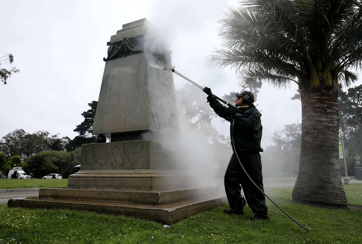 James McCormick, 3422: Park Section II Supervisor, Japanese Tea Garden and Music Concourse, San Francisco Recreation and Parks, pressure washes the pedestal of Ulysses S. Grant after the statue was toppled and the base defaced at Golden Gate Park, on Saturday, June 20, 2020, in San Francisco, Calif.