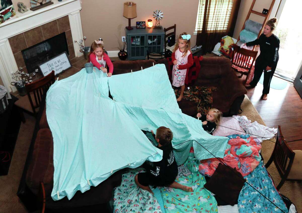 The Smart family sets up a fort as part of Family Promise of Montgomery County’s “Night Without A Bed” initiative Saturday in Montgomery. The nationwide event raises awareness of families battling homelessness.