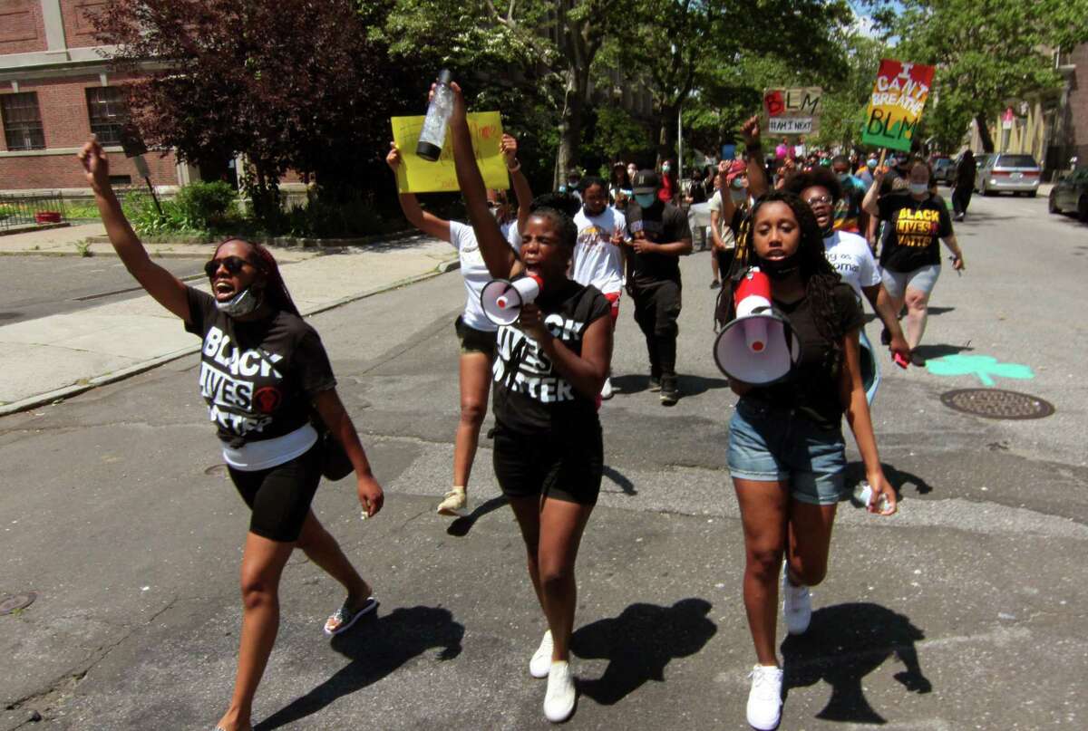 Over 100 “Black Lives Matter” protesters march along Broad Street on their way to a rally at nearby Seaside Park in downtown Bridgeport on Saturday. Activist and event organizer Bobbi Brown encouraged parents to come with their children to the march when she was on Mayor Joe Ganim's virtual town hall this week. She insists this is not a parade but rather a movement.