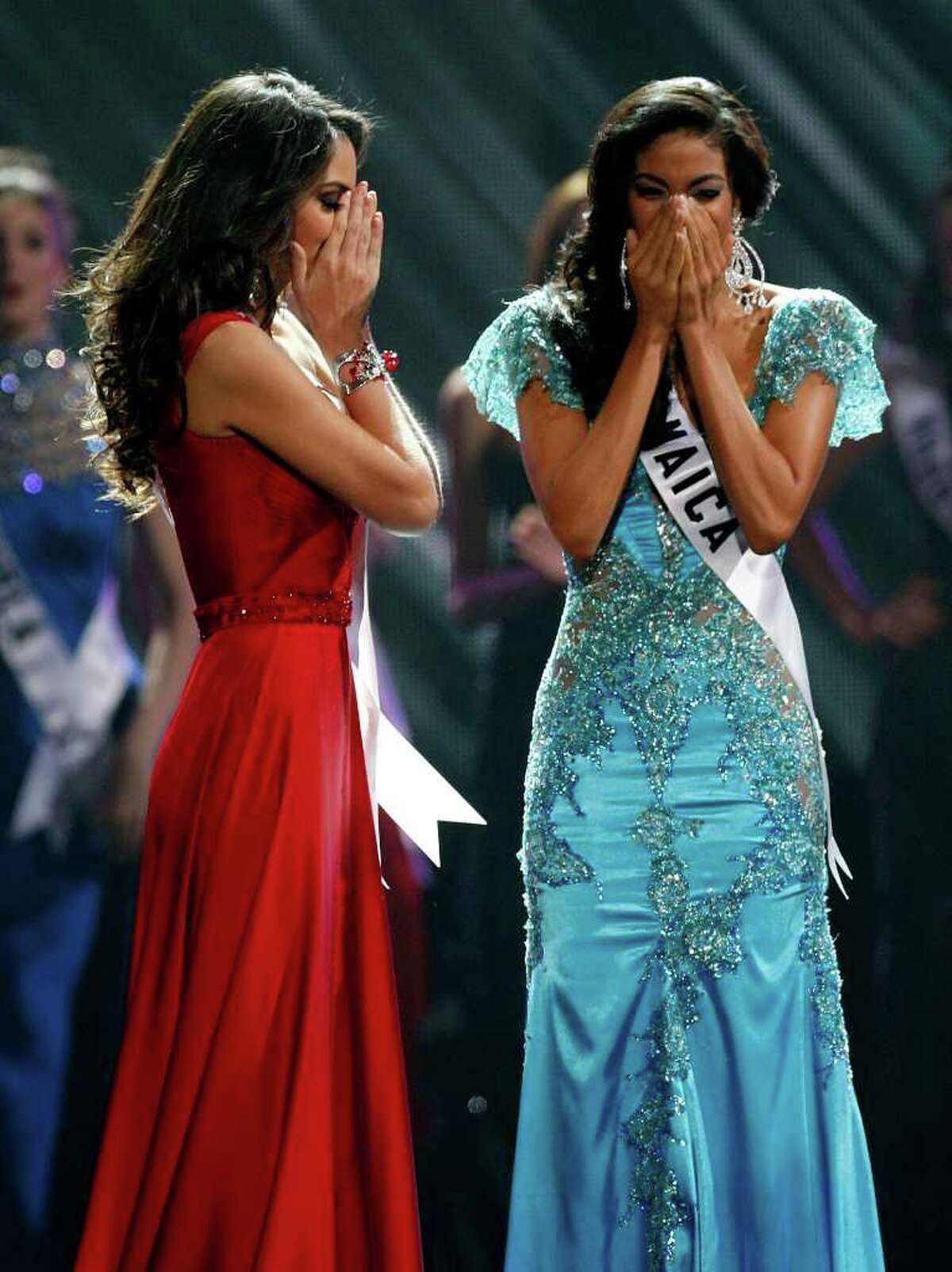 LAS VEGAS - AUGUST 23: Miss Mexico 2010, Jimena Navarrete (L), and Miss Jamaica 2010, Yendi Phillipps, react as Navarette is named the 2010 Miss Universe and Phillipps the first runner-up during the 2010 Miss Universe Pageant at the Mandalay Bay Events Center August 23, 2010 in Las Vegas, Nevada. (Photo by Ethan Miller/Getty Images)