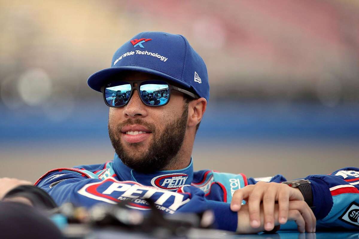 Driver Bubba Wallace stands by his car before qualifying for the NASCAR Cup Series Auto Club 400 at Auto Club Speedway in Fontana, Calif., on February 29, 2020. (Katelyn Mulcahy/Getty Images/TNS)