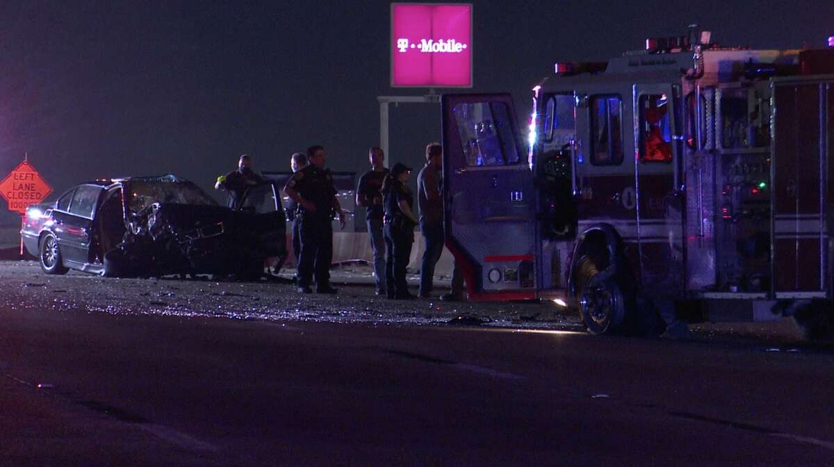 Houston police investigate after the driver of a BMW crashed into a stopped Houston Fire Department engine along the Gulf Freeway as the engine blocked traffic for another crash Sunday, June 21, 2020.