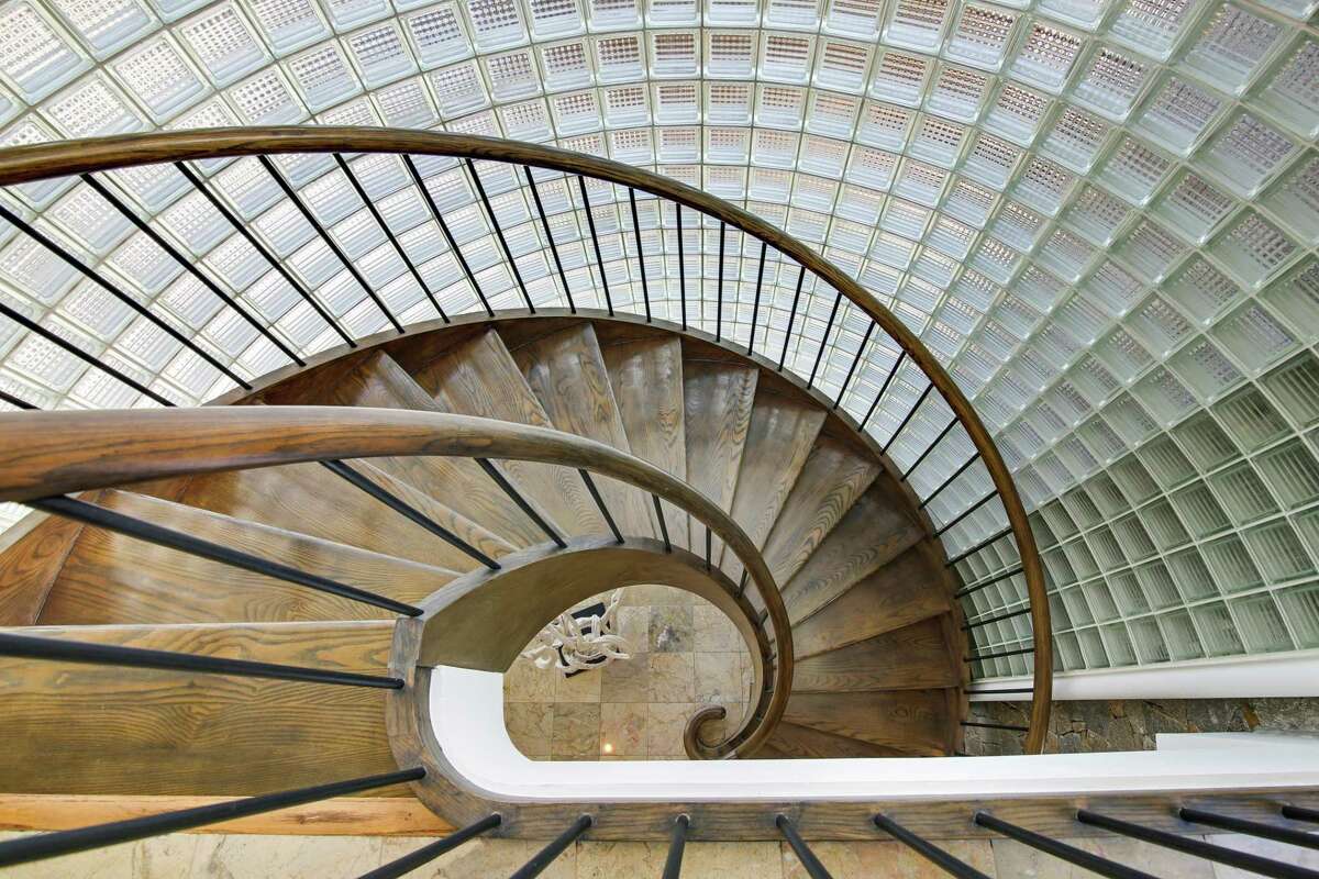 The modern glass cube “turret” houses the circular floating staircase to the second floor. ABOUT THIS HOUSE STYLE: Contemporary ADDRESS: 42 Spriteview Avenue PRICE: $2,550,000 ROOMS: 8 SCHOOLS: Kings Highway Elementary, Coleytown Middle, Staples High ASSESSMENT: $1,372,400 MILL RATE: 16.86 mills TAXES: $23,139 * ASSOCIATION FEE: $1,100, paid annually * includes beach, snow removal, road maintenance and insurance SEWER FEE: $350, paid annually
