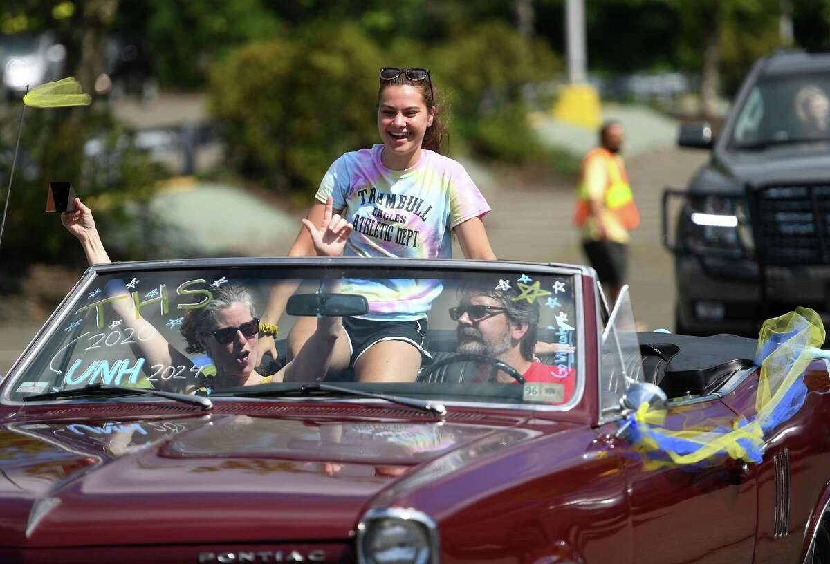 Trumbull High School grads participate in the Trumbull Eagles FlyThru street procession from the Westfield Trumbull Mall to Trumbull High School in Trumbull, Conn. on Sunday, June 21, 2020.