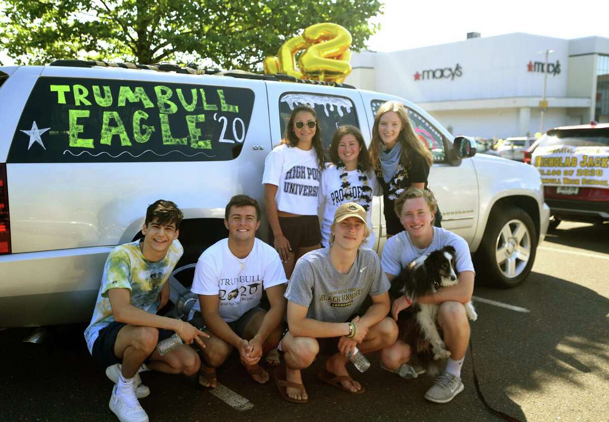 Trumbull High School grads participate in the Trumbull Eagles FlyThru street procession from the Westfield Trumbull Mall to Trumbull High School in Trumbull, Conn. on Sunday, June 21, 2020.