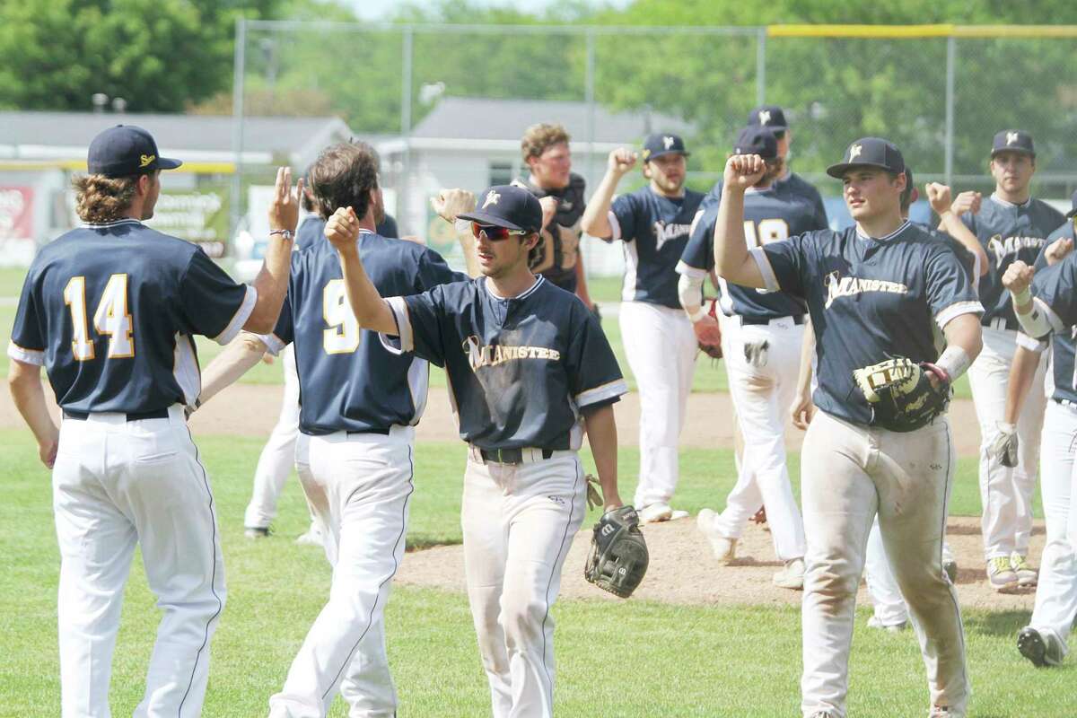 The Manistee Saints celebrate their four-game sweep of Michigan Sports Academy on Sunday at Rietz Park. (Dylan Savela/News Advocate)