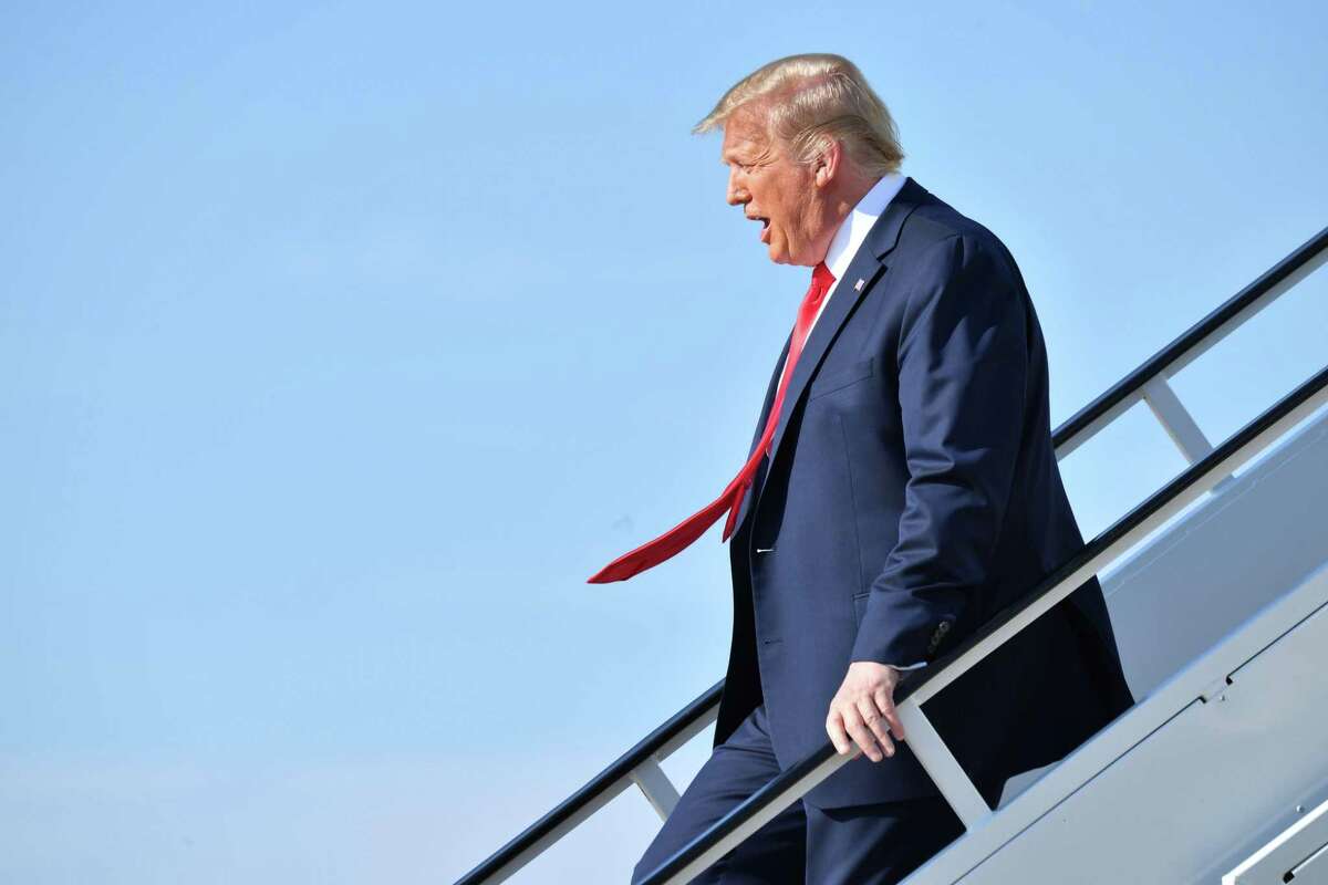 President Donald Trump steps off Air Force One at Tulsa International Airport on his way to his campaign rally June 20.