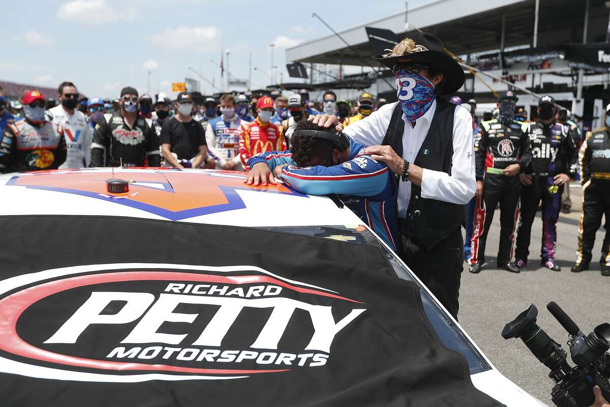 Driver Bubba Wallace, left, is overcome with emotion as team owner Richard Petty, comforts him as he arrives at his car in the pits of the Talladega Superspeedway prior to the start of the NASCAR Cup Series auto race at the Talladega Superspeedway in Talladega Ala., Monday June 22, 2020. In an extraordinary act of solidarity with NASCAR’s only Black driver, dozens of drivers pushed the car belonging to Bubba Wallace to the front of the field before Monday’s race as FBI agents nearby tried to find out who left a noose in his garage stall over the weekend. (AP Photo/John Bazemore)
