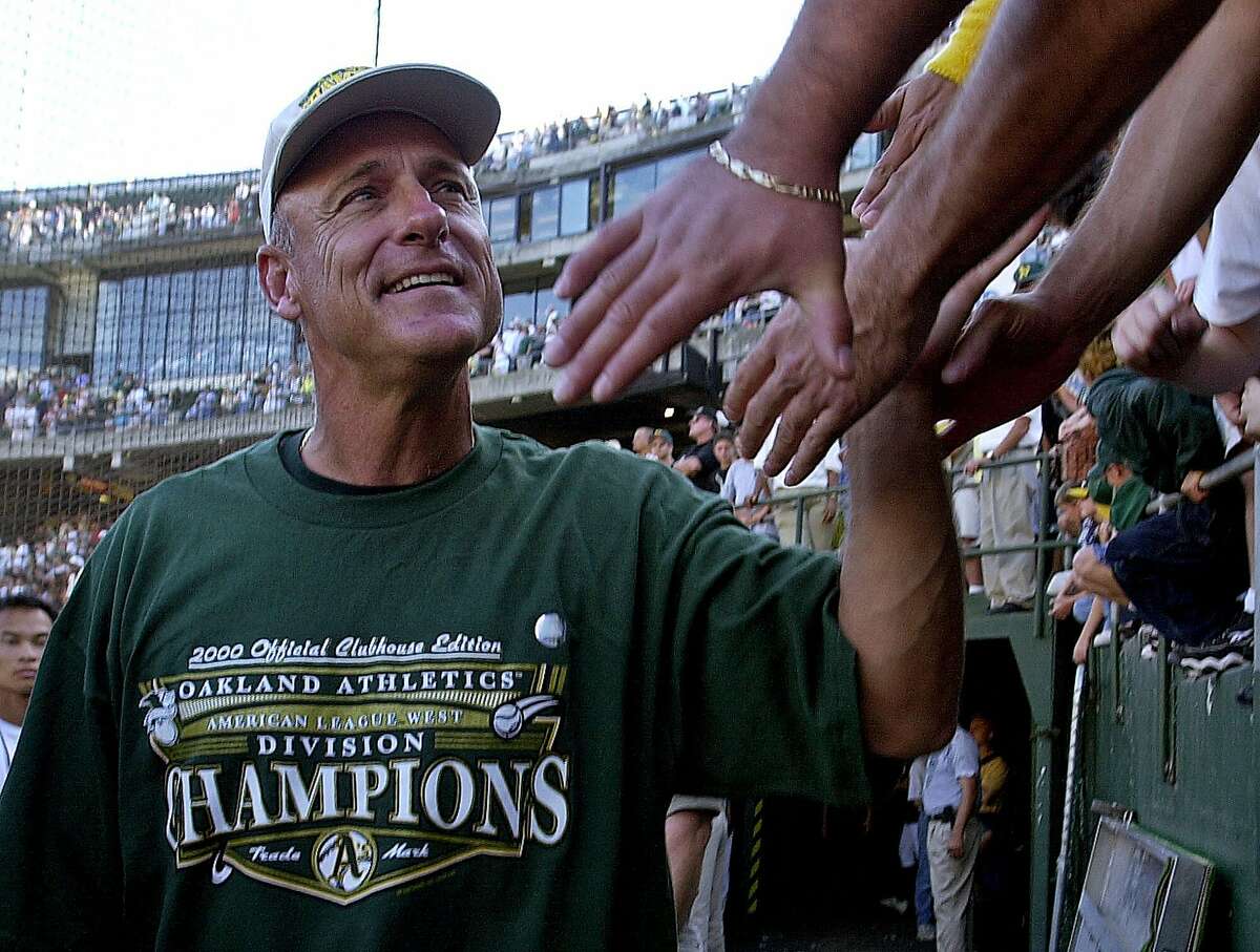 Oakland Athletics' manager Art Howe is greeted by fans upon returning to the field after the A's defeated the Texas Rangers 3-0 to clinch the AL west division Sunday, Oct. 1, 2000, in Oakland, Calif. (AP Photo/Ben Margot)