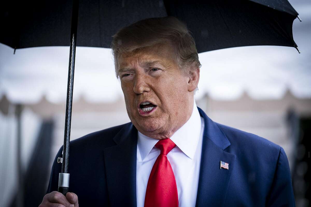 WASHINGTON, DC - JUNE 20:President Donald Trump stops to speak to the media in the rain on the South Lawn of the White House as he prepares to depart aboard Marine One for a rally in Tulsa, OK, on June 20, 2020 in Washington, DC. The rally is Trump's first in months since the coronavirus lockdown and his campaign acknowledged that six staff members had tested positive for the virus during routine screening. (Photo by Pete Marovich/Getty Images)