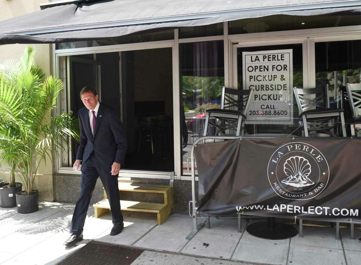 U.S. Sen. Richard Blumenthal, D-Conn, departs after a meeting with the owners of Caribbean-American restaurant La Perle in downtown Stamford, Conn., on June 22, 2020.