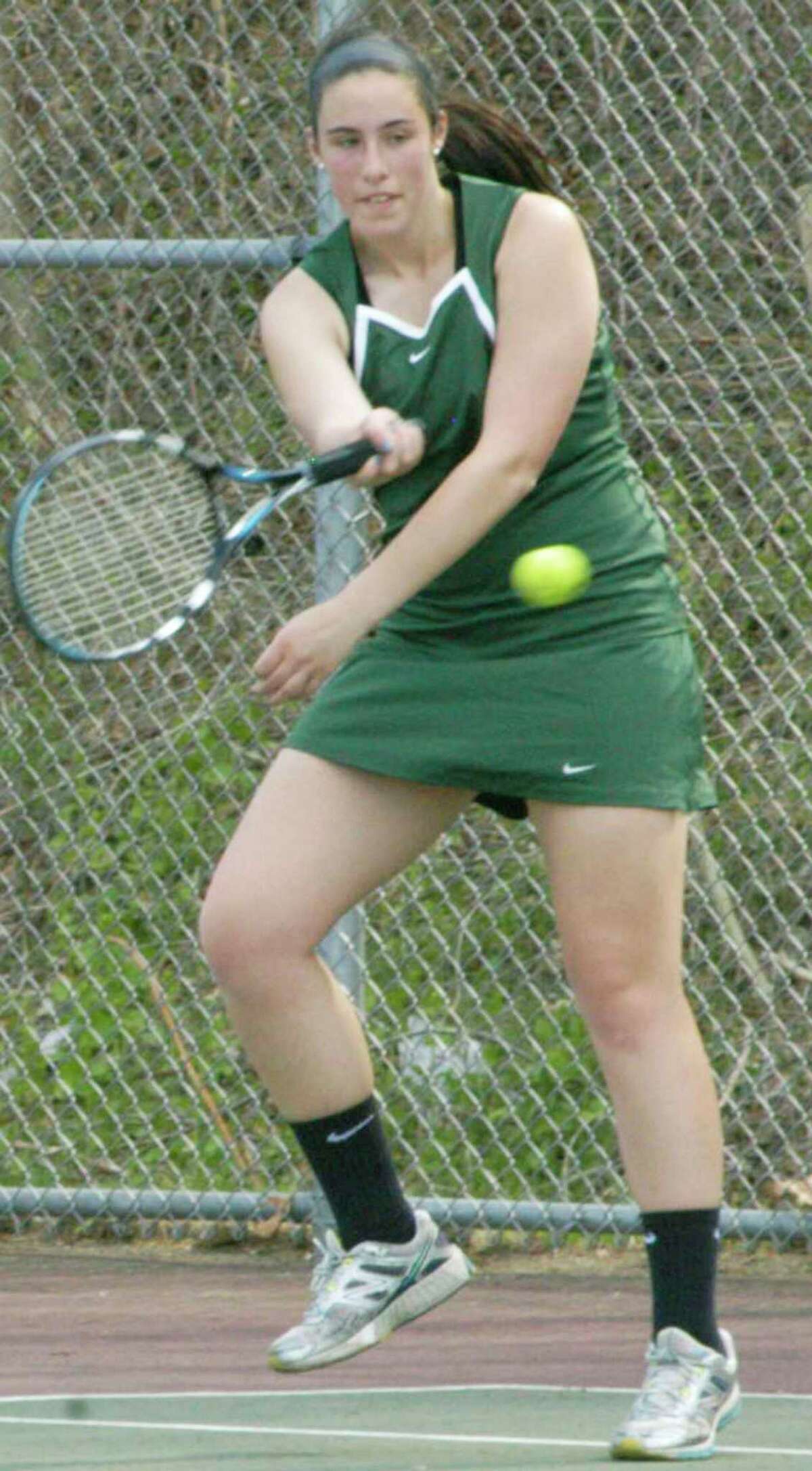 Veteran Shannon Jugler of New Milford High School girls' tennis rips a forehand return during a recent match at the NMHS courts. May 2015