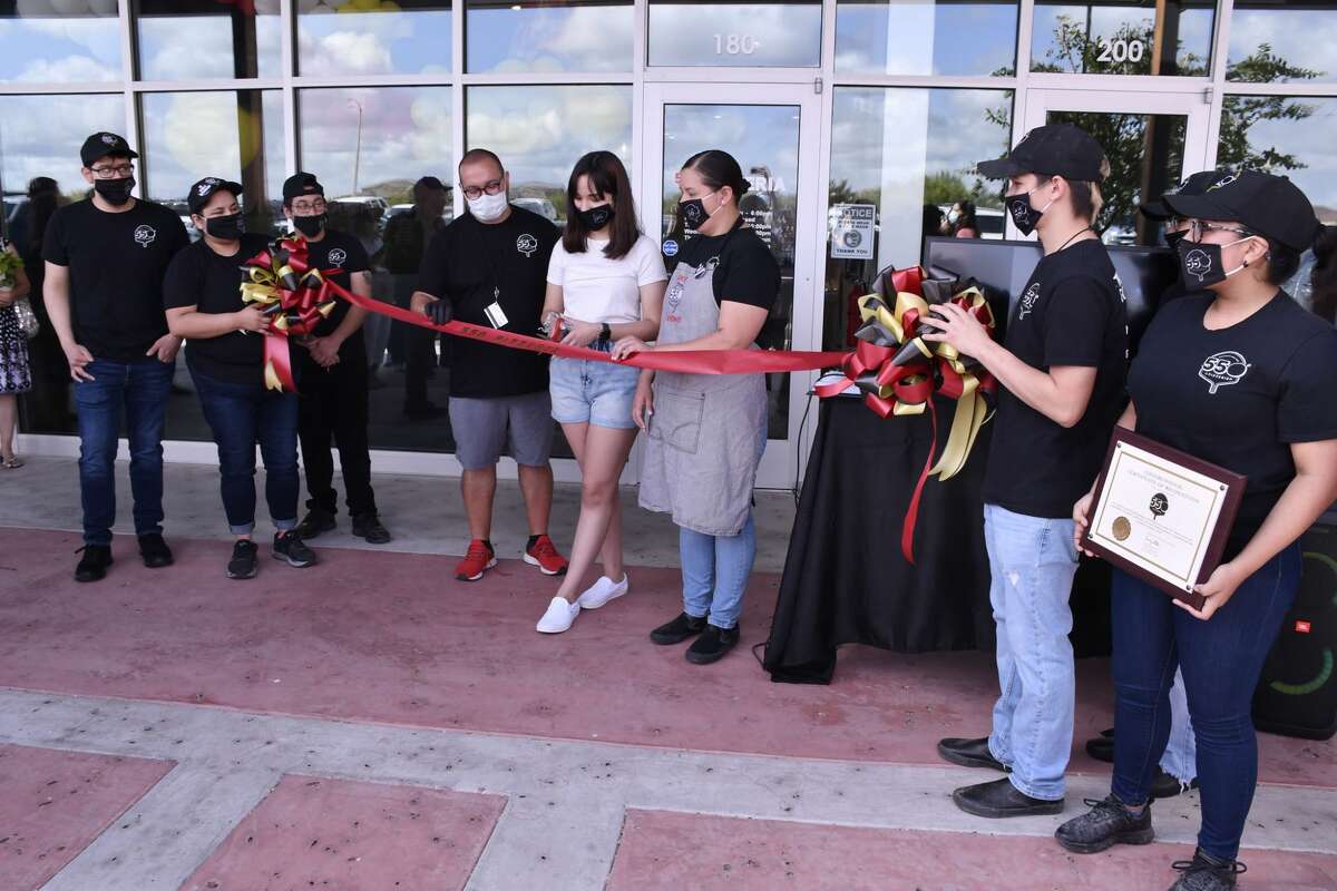 Employees participated as Miguel, Jesika October and Janet Duran cut the ribbon to Laredo's newest pizza restaurant, 550 Pizzeria, Saturday, June 20, 2020. The business is located at The Shoppes at Shiloh at 2121 Shiloh Drive.
