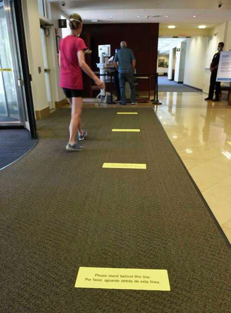 Social distancing markers are at the entrance of Greenwich Hospital in Greenwich, Conn. Tuesday, June 23, 2020. The hospital has put many new safety measures in place as it reopens for all services. Photo: Tyler Sizemore / Hearst Connecticut Media / Greenwich Time