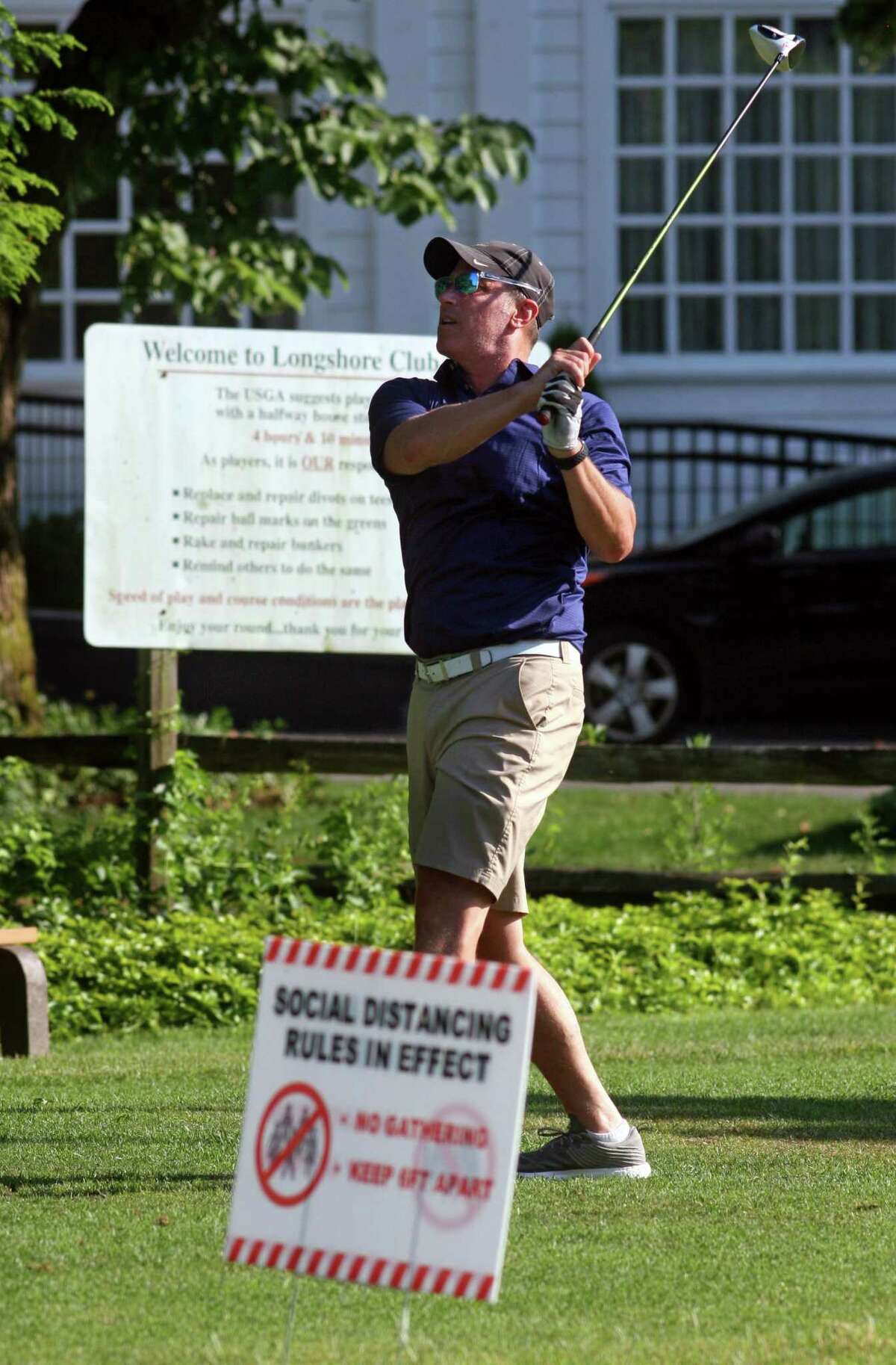 Andy Udell, of Westport, tee off on the first hole of the Longshore Golf Course in Westport, Connecticut on Tuesday, June 23, 2020.