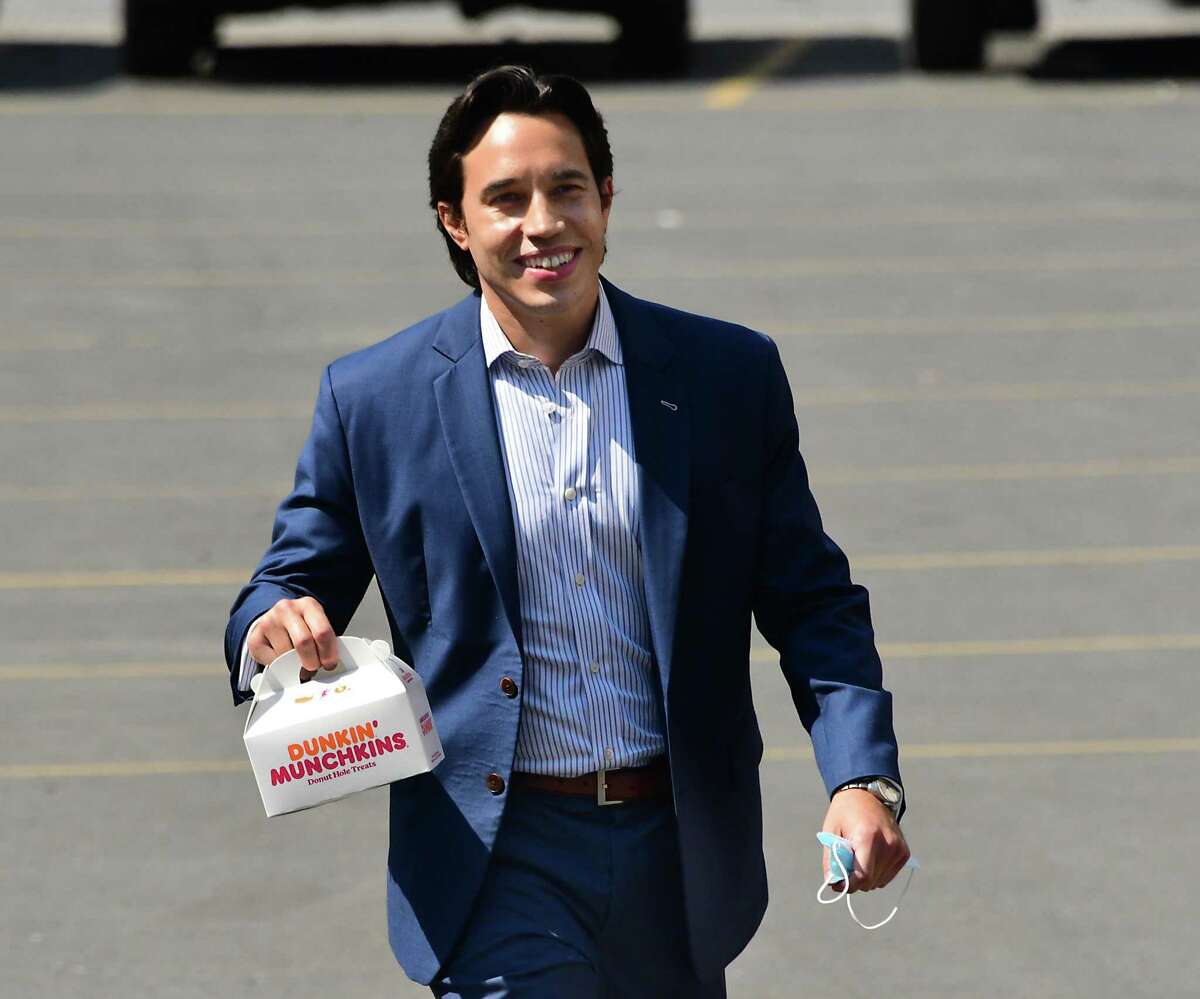 Matt Toporowski brings election workers Dunkin' Munchkins as he shows up to casts his ballot in Democratic Primary for Albany County District Attorney at The First Church on Tuesday, June 23, 2020 in Albany, N.Y. Matt is running against current DA David Soares. (Lori Van Buren/Times Union)